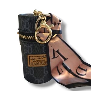 Stylish Black Lipstick Bag with Gold Accents